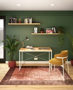 an office room with a green wall
